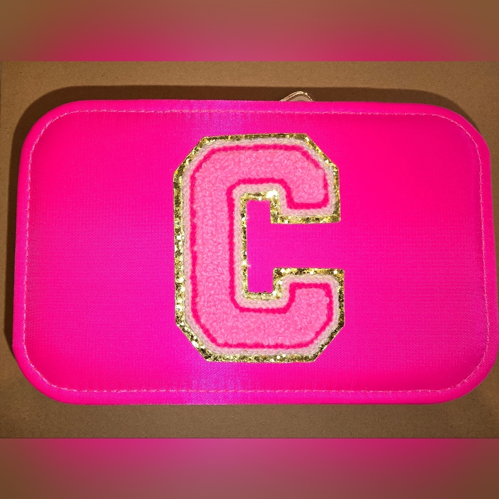 Elegant Pink and Gold Jewelry Case with Decorative Embellishment